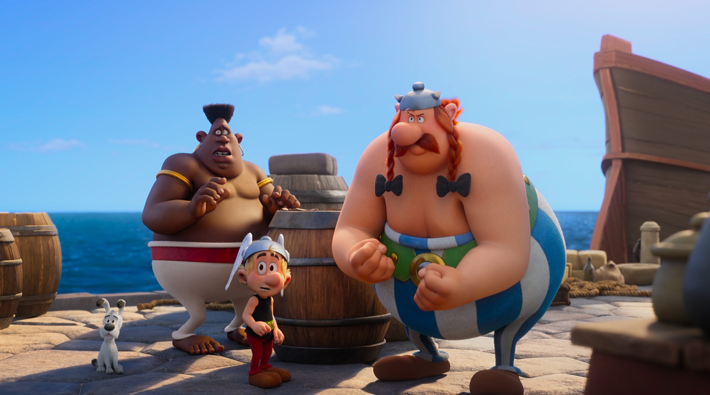Obelix stellt sich einer Herausforderung, bevor die Reisegruppe ein Schiff nach Nubien besteigen kann.